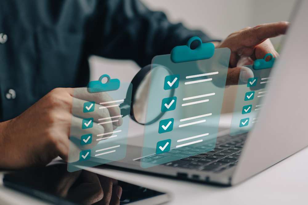 A Businessman preparing a website development checklist on the laptop.